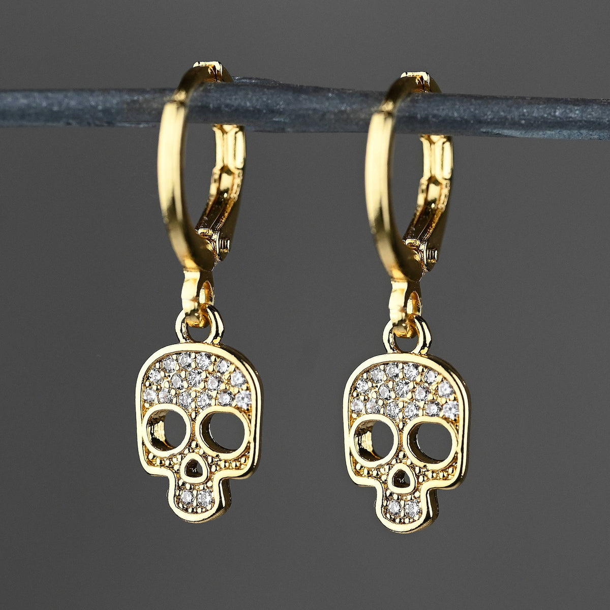 Small Crystal Pave Skull Huggie Earrings